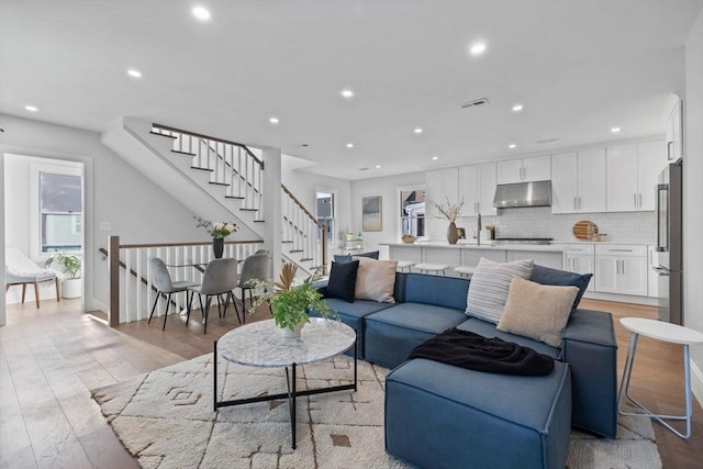 living room with light hardwood / wood-style floors