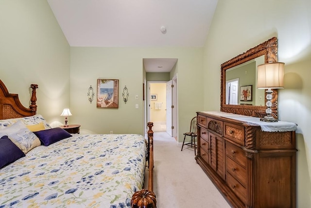 bedroom featuring vaulted ceiling and light carpet