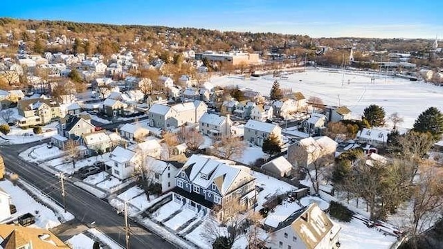 snowy aerial view featuring a residential view