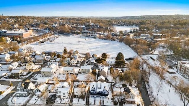 snowy aerial view with a residential view