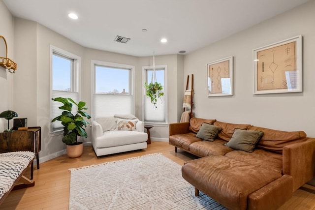 living room with light hardwood / wood-style floors