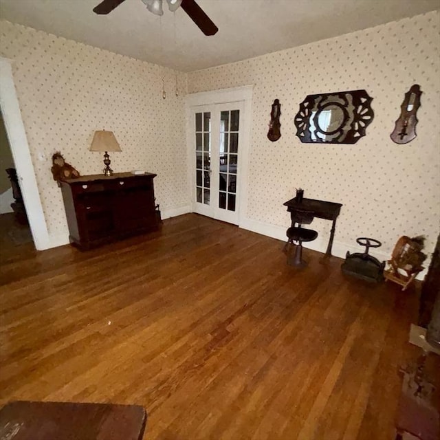 interior space featuring french doors, ceiling fan, and dark hardwood / wood-style flooring