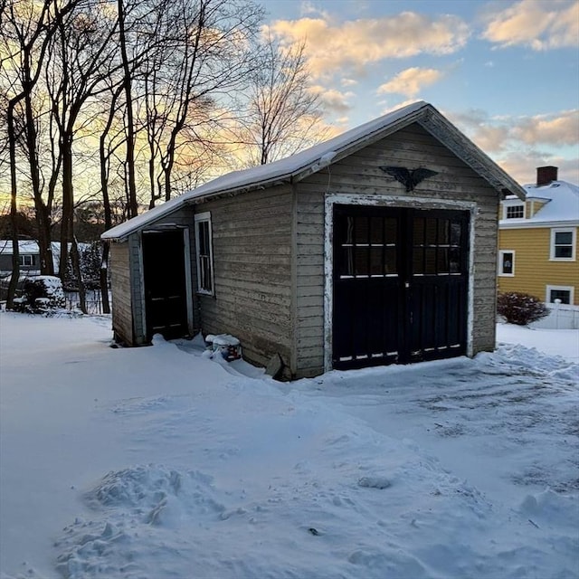 view of snow covered garage