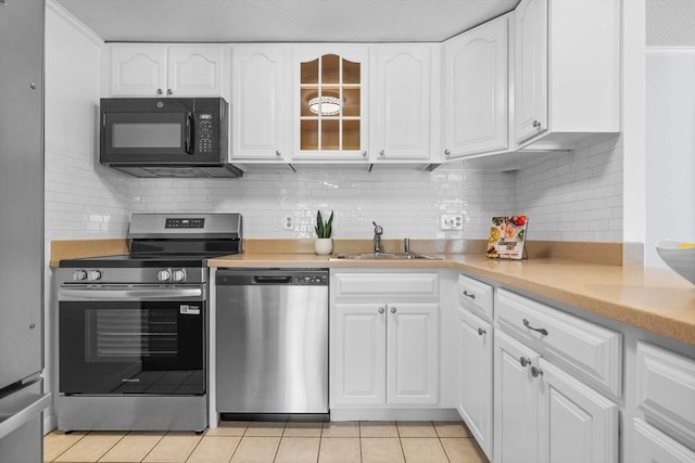 100 Park Terrace Dr Unit 124, Stoneham, MA 02180 - kitchen featuring stainless steel appliances, a sink, and white cabinets
