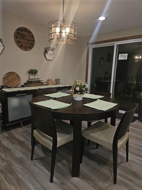 dining area with wood-type flooring