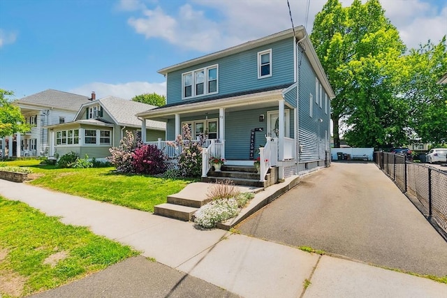 63 Beverly St, Chicopee, MA 01013 - american foursquare style home featuring a porch and driveway