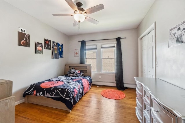 63 Beverly St, Chicopee, MA 01013 - bedroom featuring light wood-type flooring, a closet, baseboard heating, and ceiling fan
