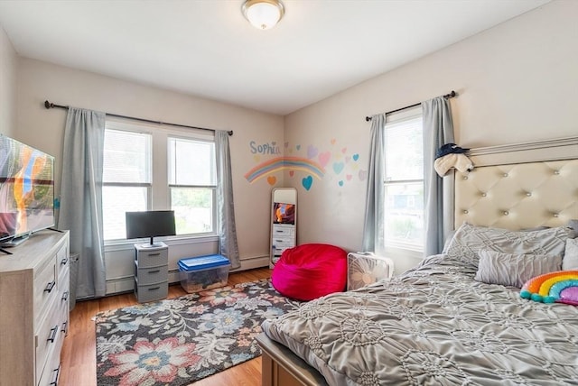 63 Beverly St, Chicopee, MA 01013 - bedroom featuring light wood finished floors and baseboard heating