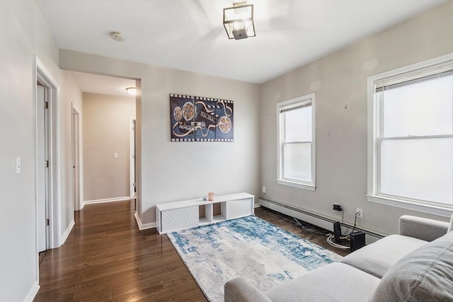 63 Beverly St, Chicopee, MA 01013 - sitting room with wood finished floors, baseboards, and a baseboard radiator