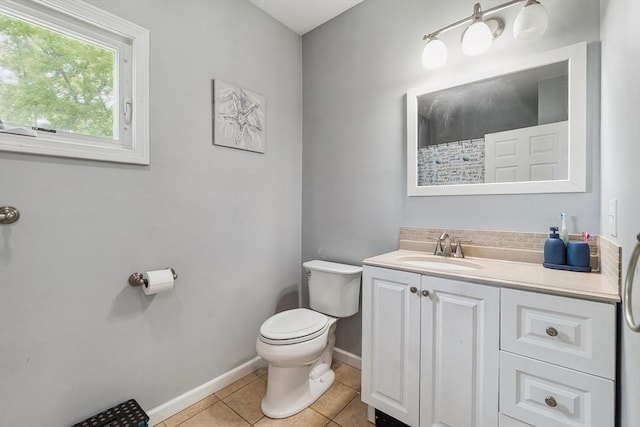 63 Beverly St, Chicopee, MA 01013 - full bath featuring toilet, vanity, tile patterned floors, baseboards, and curtained shower