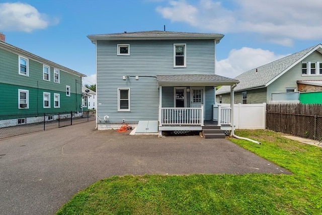 63 Beverly St, Chicopee, MA 01013 - rear view of property featuring a porch and a patio