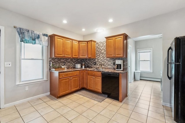 63 Beverly St, Chicopee, MA 01013 - kitchen featuring black appliances, a baseboard heating unit, a sink, tasteful backsplash, and brown cabinetry