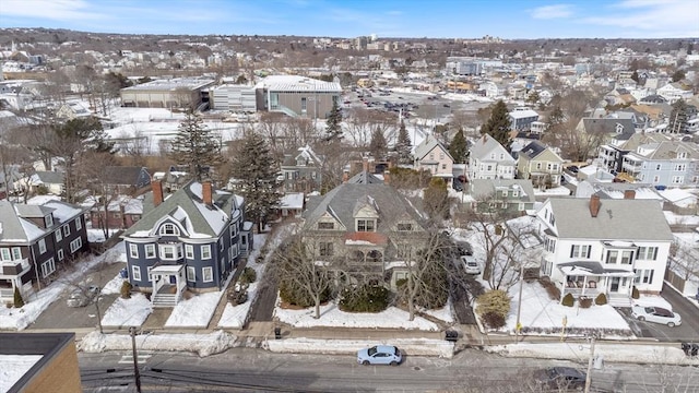 snowy aerial view featuring a residential view