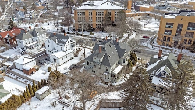 snowy aerial view featuring a residential view