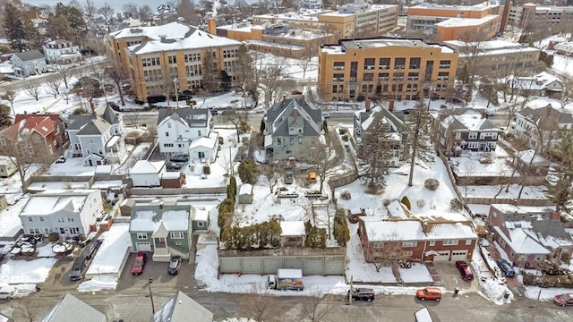 snowy aerial view with a residential view