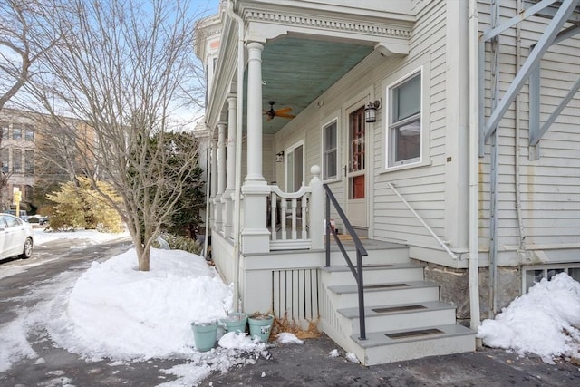 view of snow covered property entrance