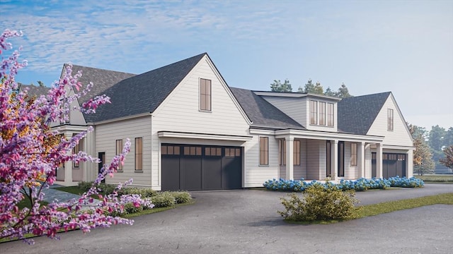 view of front of house featuring a garage and covered porch