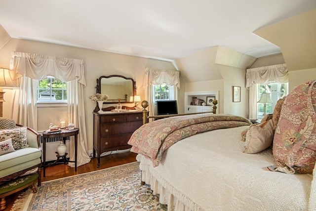 bedroom with hardwood / wood-style flooring and vaulted ceiling