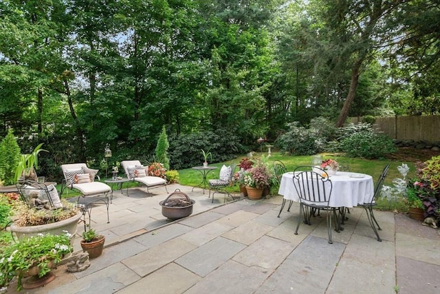 view of patio featuring an outdoor fire pit