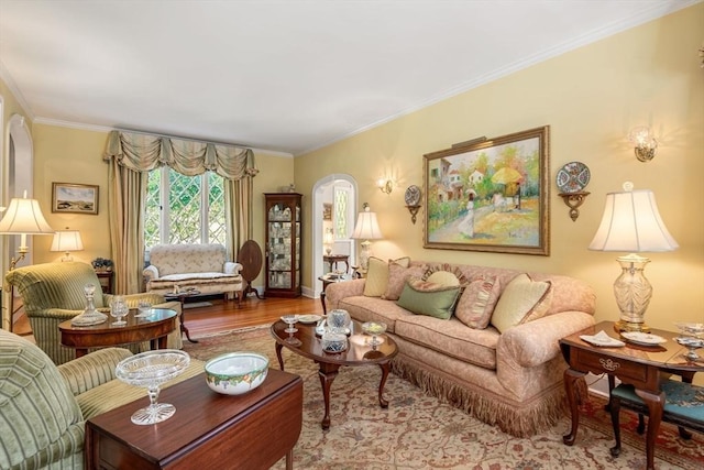 living room featuring hardwood / wood-style flooring and ornamental molding