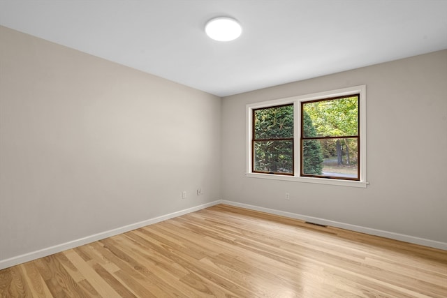 spare room with light hardwood / wood-style floors