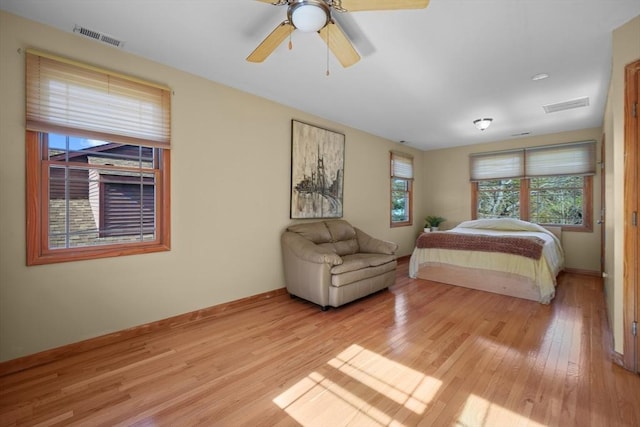 bedroom featuring ceiling fan and light hardwood / wood-style floors