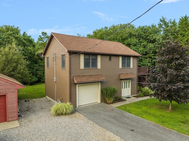 view of front of property featuring a garage and a front yard