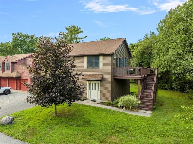 view of front of home featuring a front yard and a deck