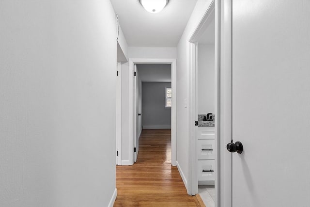 corridor featuring light hardwood / wood-style flooring