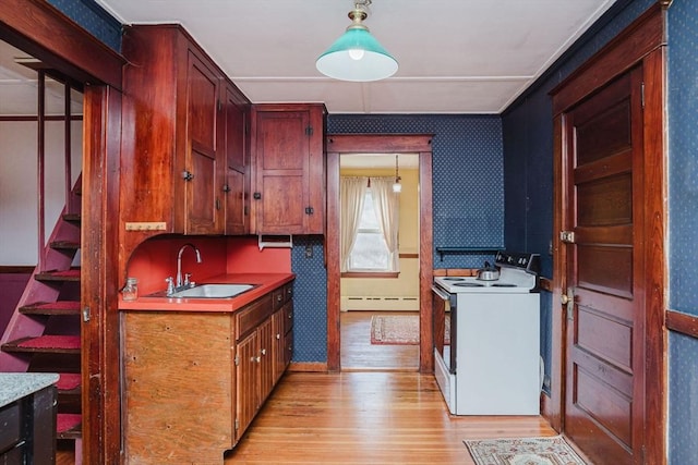 kitchen featuring white range with electric cooktop, sink, a baseboard radiator, and decorative light fixtures