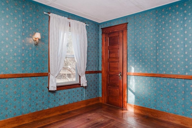 spare room with hardwood / wood-style floors