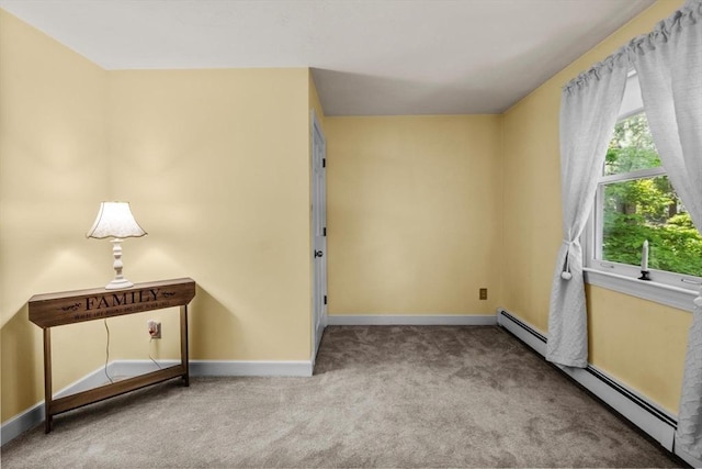 23 Fletcher St, Foxboro, MA 02035 - carpeted empty room with baseboards and a baseboard heating unit