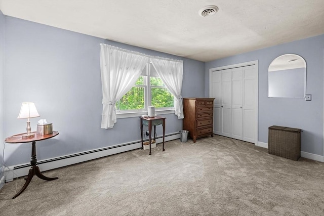 23 Fletcher St, Foxboro, MA 02035 - bedroom featuring carpet floors, baseboard heating, a closet, baseboards, and arched walkways