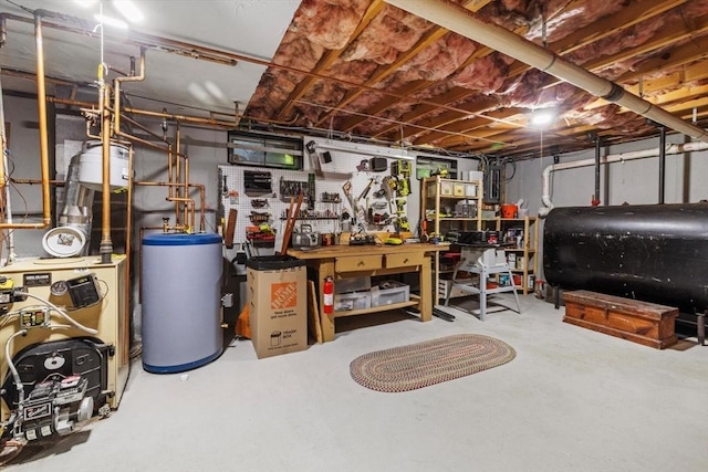 23 Fletcher St, Foxboro, MA 02035 - unfinished below grade area with heating fuel, water heater, a workshop area, and a heating unit