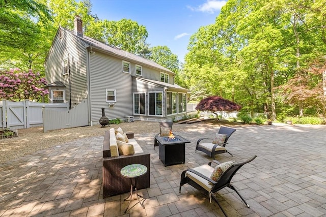 23 Fletcher St, Foxboro, MA 02035 - view of patio with a fire pit, a sunroom, and a gate