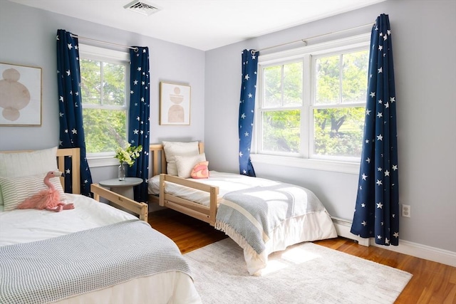 17-19 Beech Gln, Boston, MA 02119 - bedroom featuring wood finished floors and baseboards
