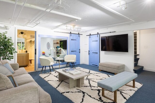 17-19 Beech Gln, Boston, MA 02119 - living room with a barn door, baseboards, stairway, and carpet flooring