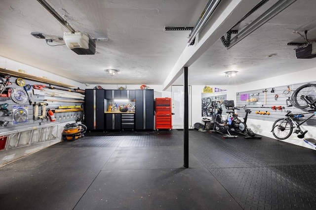 17-19 Beech Gln, Boston, MA 02119 - garage with a workshop area and a garage door opener