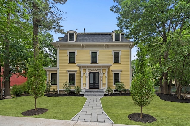 italianate-style house with a front lawn