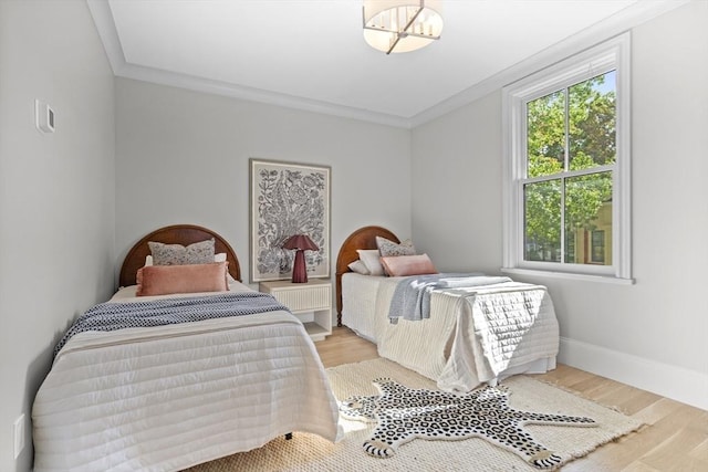 17 Alveston St, Boston, MA 02130 - bedroom with ornamental molding, light wood-style flooring, and baseboards