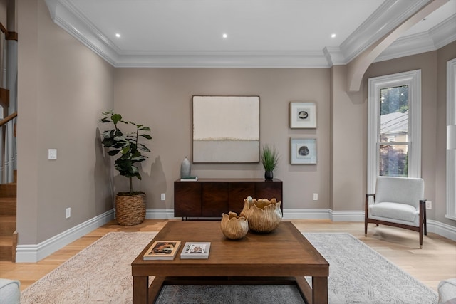 sitting room featuring ornamental molding and light hardwood / wood-style flooring