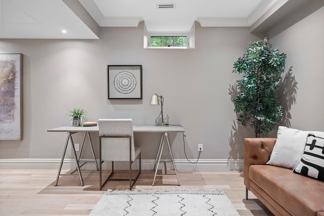 office featuring crown molding and light hardwood / wood-style floors