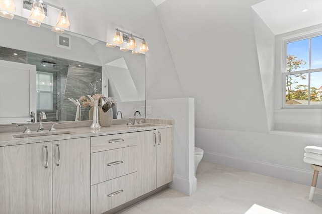 bathroom with lofted ceiling, vanity, walk in shower, and toilet