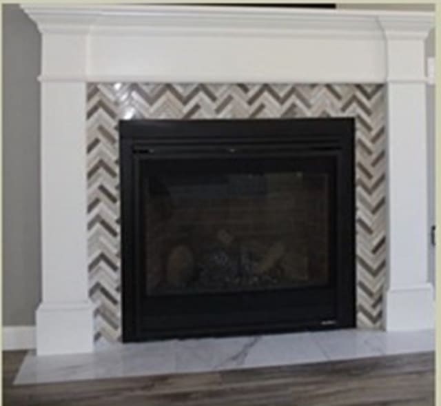 details with a tiled fireplace