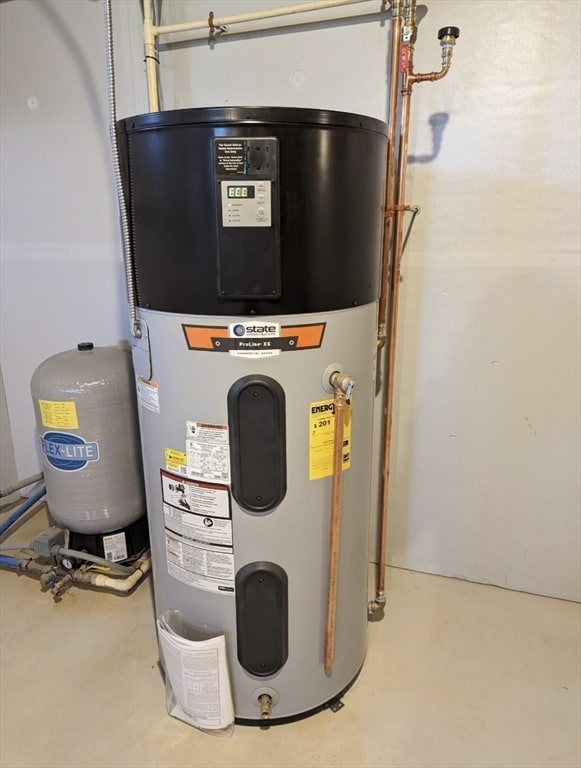 utility room with hybrid water heater