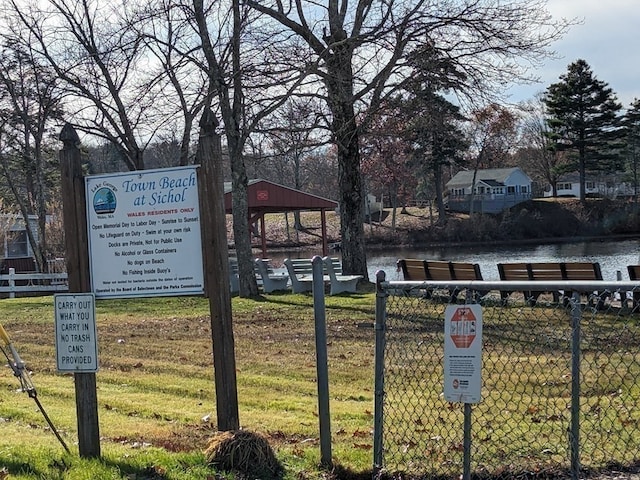 surrounding community featuring a gazebo, a yard, and a water view