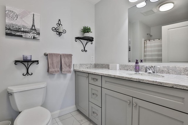 bathroom with marble finish floor, toilet, vanity, a shower with curtain, and baseboards