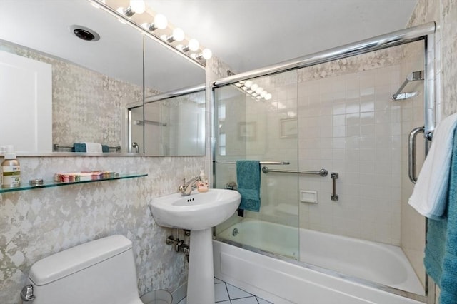 2 Hawthorne Pl Unit 2E & 2F, Boston, MA 02114 - full bath featuring bath / shower combo with glass door, toilet, and tile patterned floors