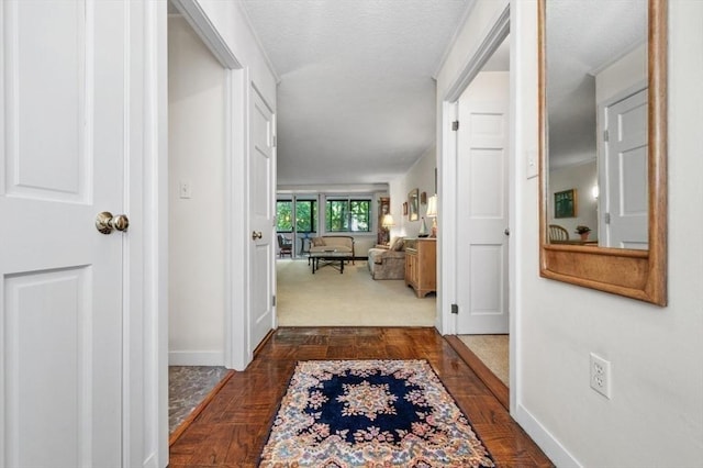 2 Hawthorne Pl Unit 2E & 2F, Boston, MA 02114 - corridor featuring baseboards and a textured ceiling