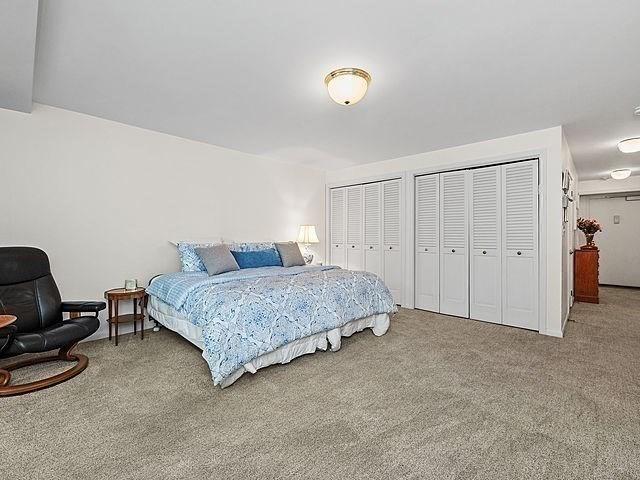2 Hawthorne Pl Unit 2E & 2F, Boston, MA 02114 - carpeted bedroom with two closets